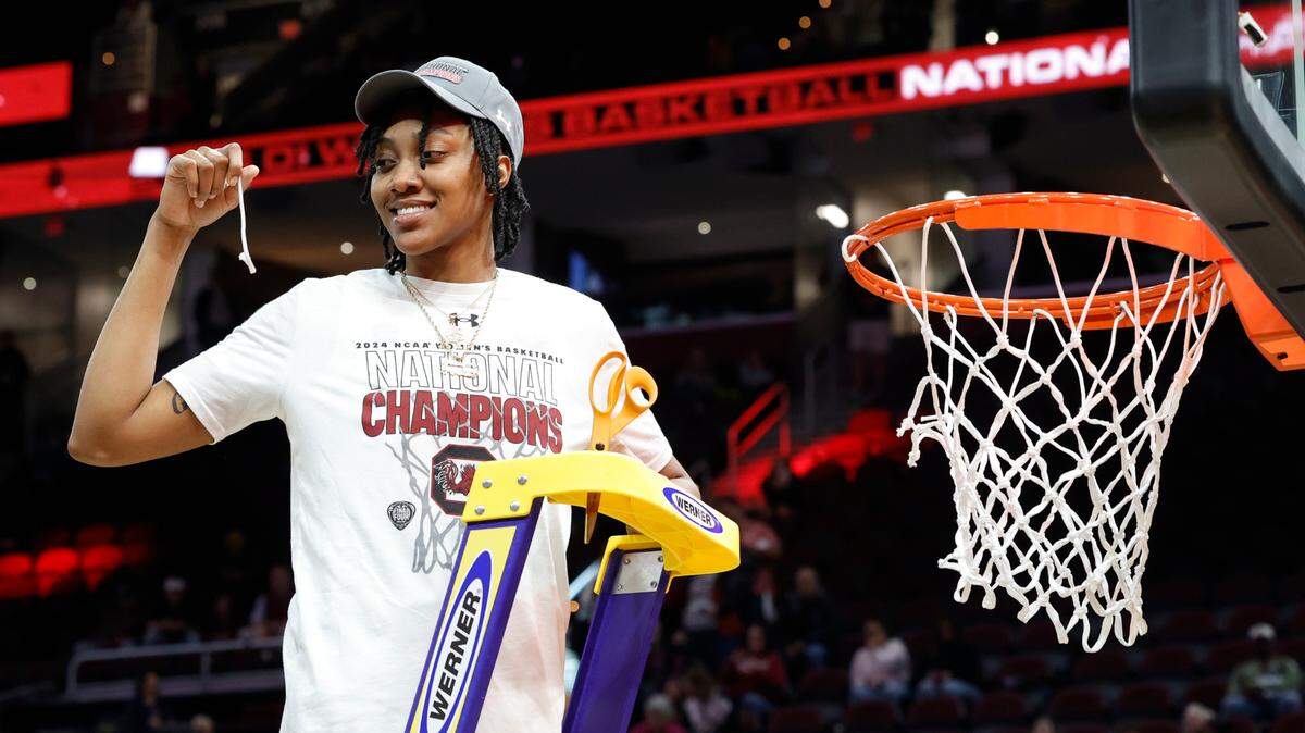 South Carolina’s Ashlyn Watkins (2) cut a piece of the net after winning the National Championship after beating Iowa at the Rocket Mortgage FieldHouse in Cleveland, Ohio on Sunday April 7, 2024.