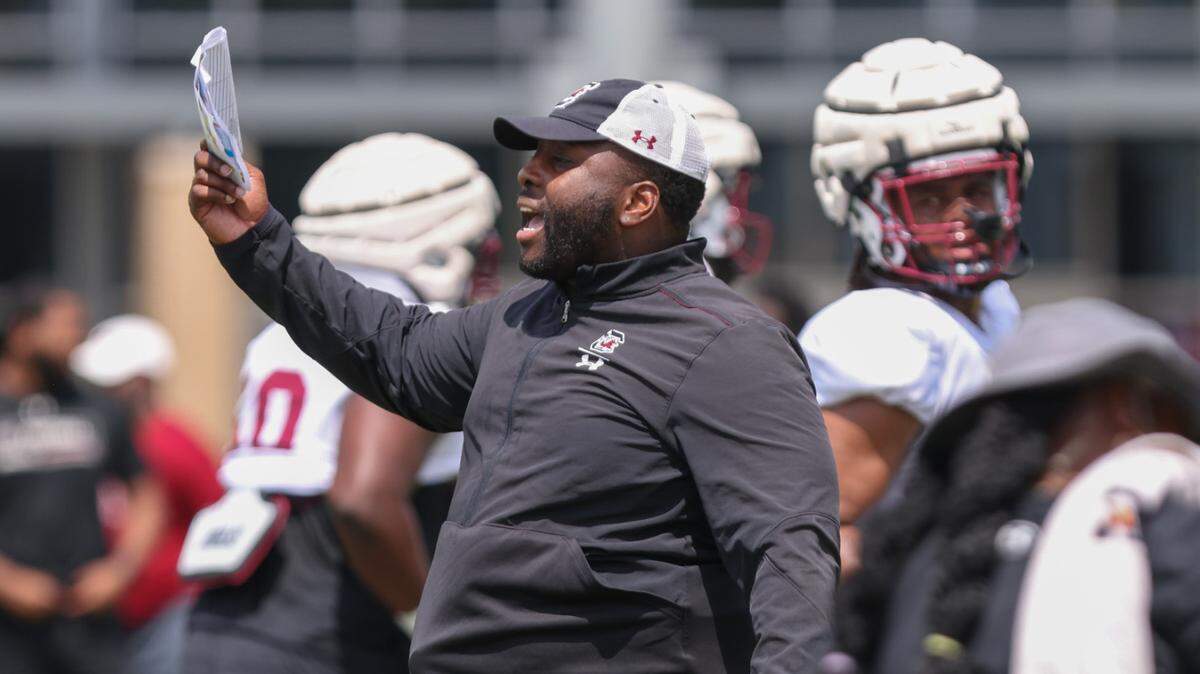 South Carolina defensive ends and linebackers coach Sterling Lucas runs drills during practice in Columbia on Monday, August 7, 2023.