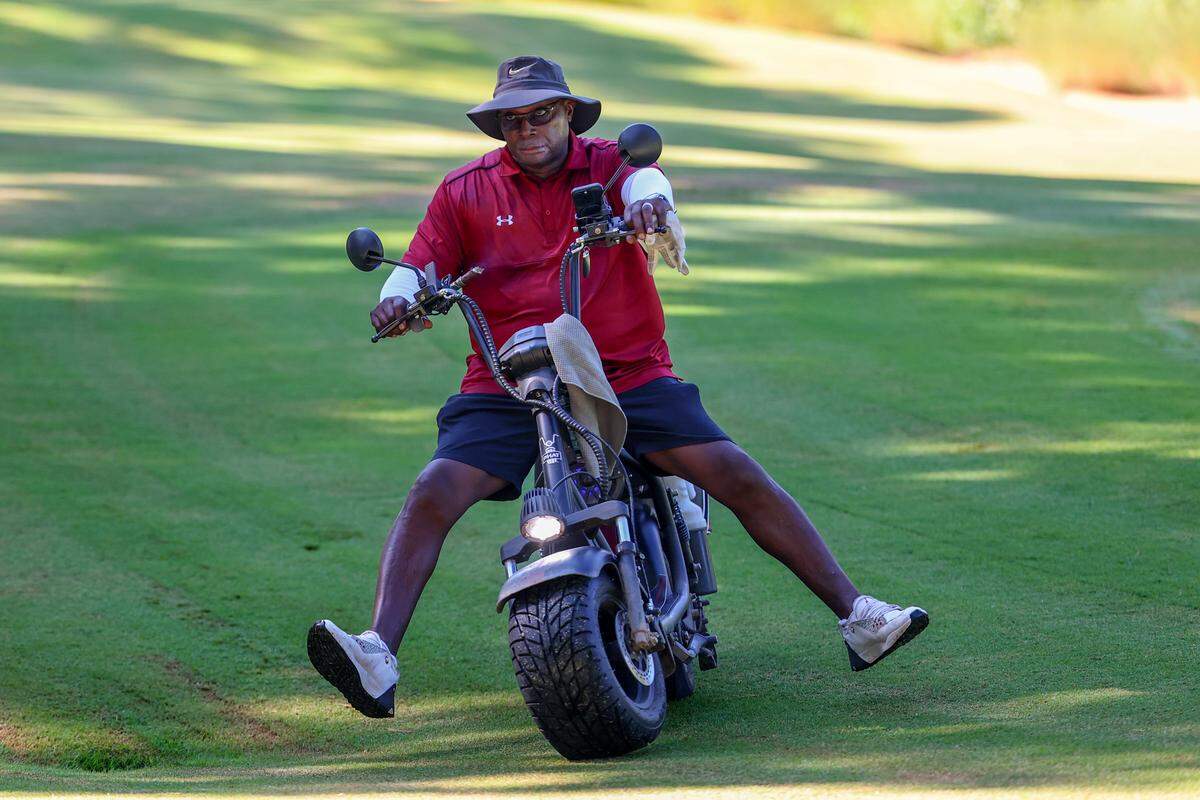 Sterling Sharpe rides his golf scooter during the Birdies with Beamer event at Cobblestone Club on Monday, July 28, 2025.
