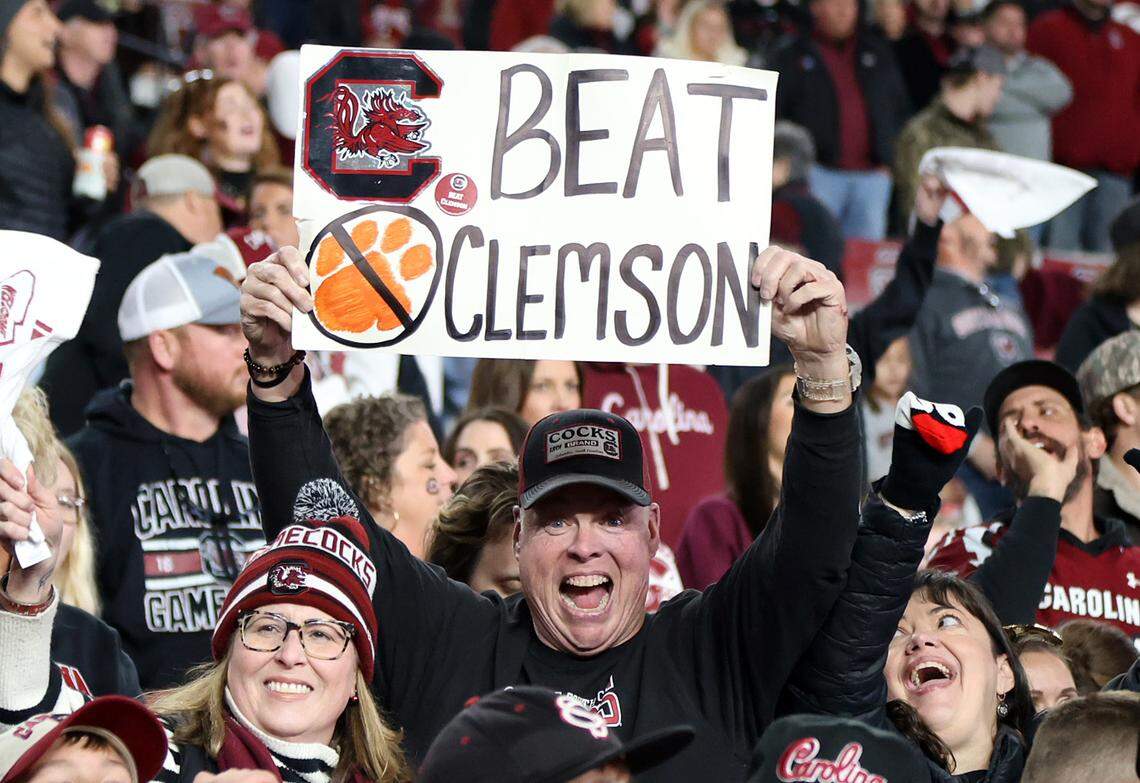A South Carolina fan holds up a Beat Clemson sign during Saturday’s game against Wofford at Williams-Brice Stadium.