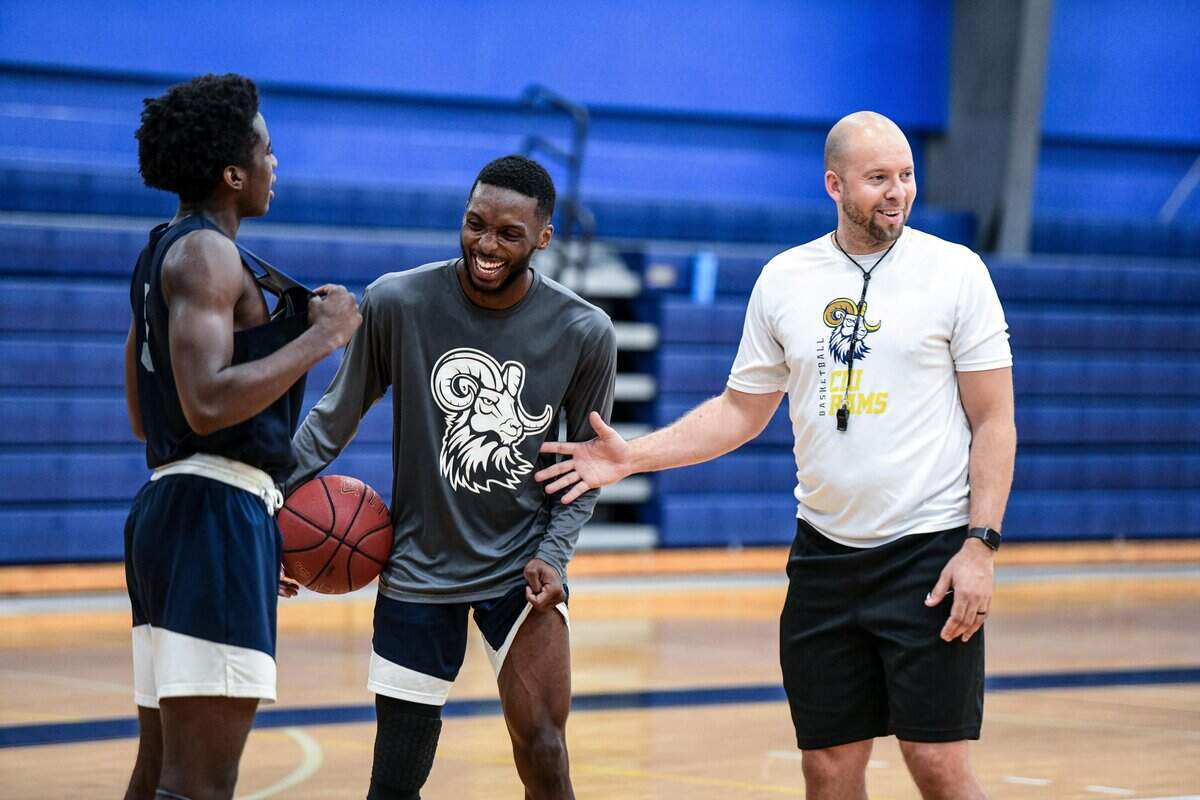 CIU head coach Tony Stockman shares a laugh with Tajae Anderson during practice at Columbia International University Wednesday, Oct. 23, 2019, in Columbia, S.C. CIU will play the Gamecocks in an exhibition game on Oct. 30.