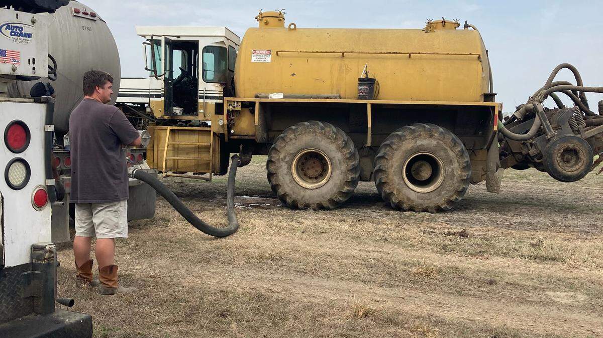 Sludge is often applied as fertilizer to farmland in South Carolina. It’s considered good for plant growth, but there are growing questions about whether toxic materials are in the sludge. This photo, from March 2023, shows a sludge spreading operation in Darlington County.