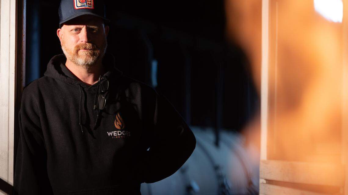 Robbie Robinson, owner of City Limits Barbeque in West Columbia, watches as his coals get hot at his restaurant on Friday, March 28, 2025.
