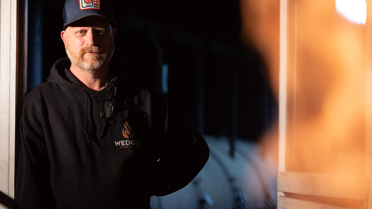 Robbie Robinson, owner of City Limits Barbeque in West Columbia, watches as his coals get hot at his restaurant on Friday, March 28, 2025.