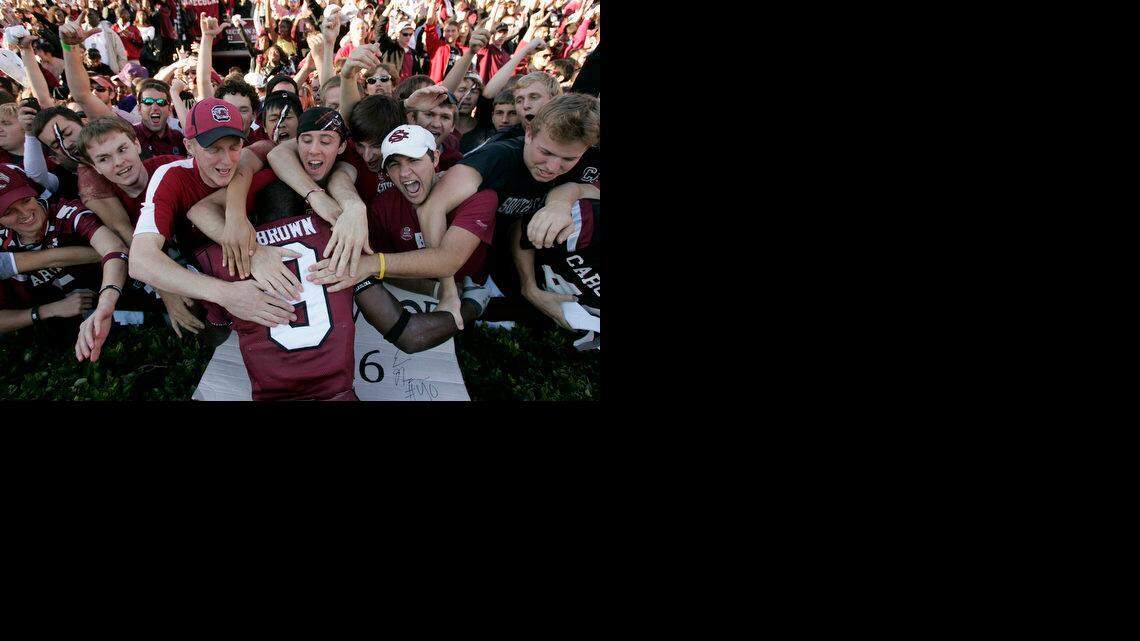 University of South Carolina fans celebrate the Gamecocks 34-17 victory over Clemson University with No. 9 Moe Brown at Williams-Brice Stadium in 2009.