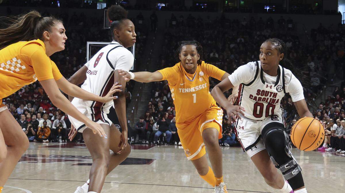 South Carolina's Ta'Niya Latson (00) drives towards the basket as South Carolina's Joyce Edwards (8) blocks out Tennessee's Lauren Hurst (7) nduring the first half of action of their women's basketball game against Tennessee at Colonial Life Arena on Sunday, Feb. 8, 2026.