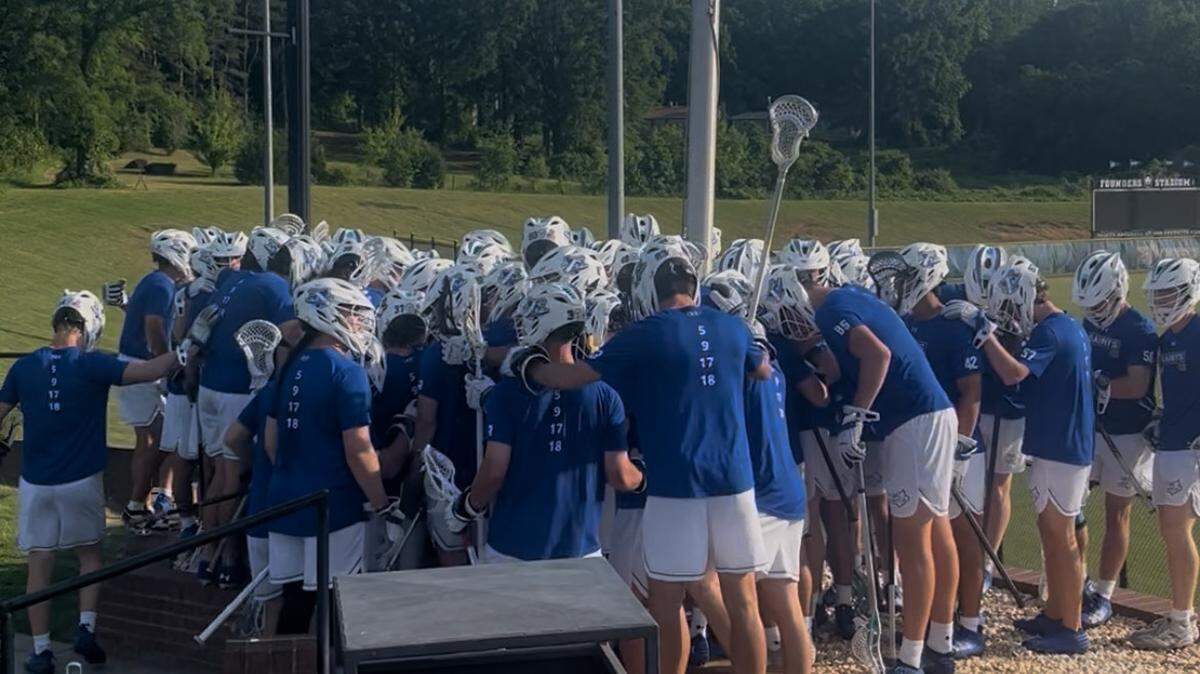The Limestone University men’s lacrosse team is shown on April 30 at a conference playoff game, one day after the university announced it would close after 180 years.