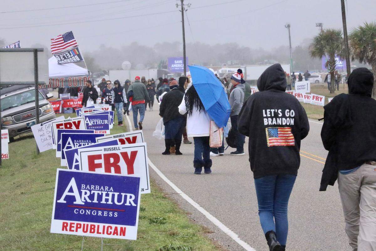 Supporters gather hours ahead of former President Donald Trump’s rally in Florence, S.C., on Saturday, March 12, 2022.
