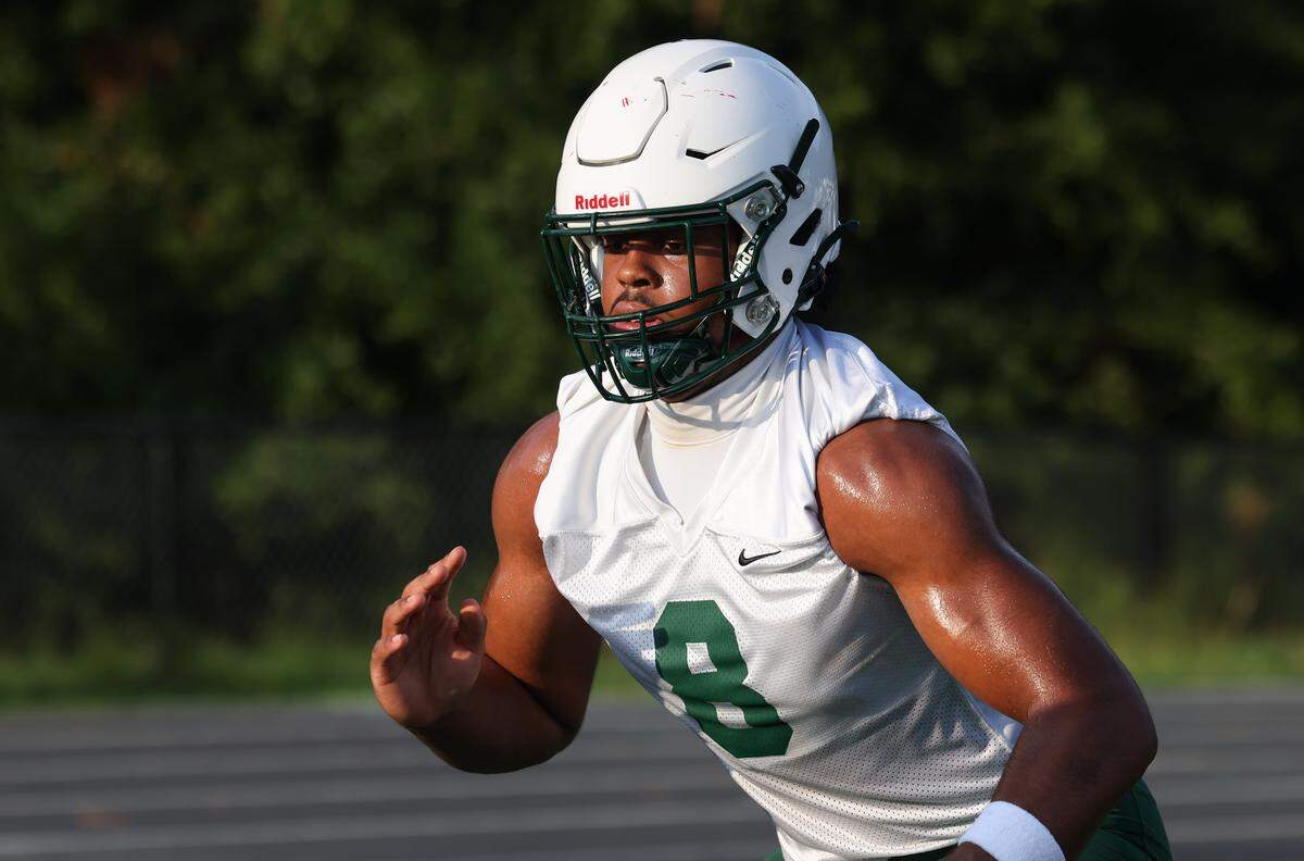 Dutch Fork defensive end Julian Walker (8) runs drills during practice at Dutch Fork in Irmo.
