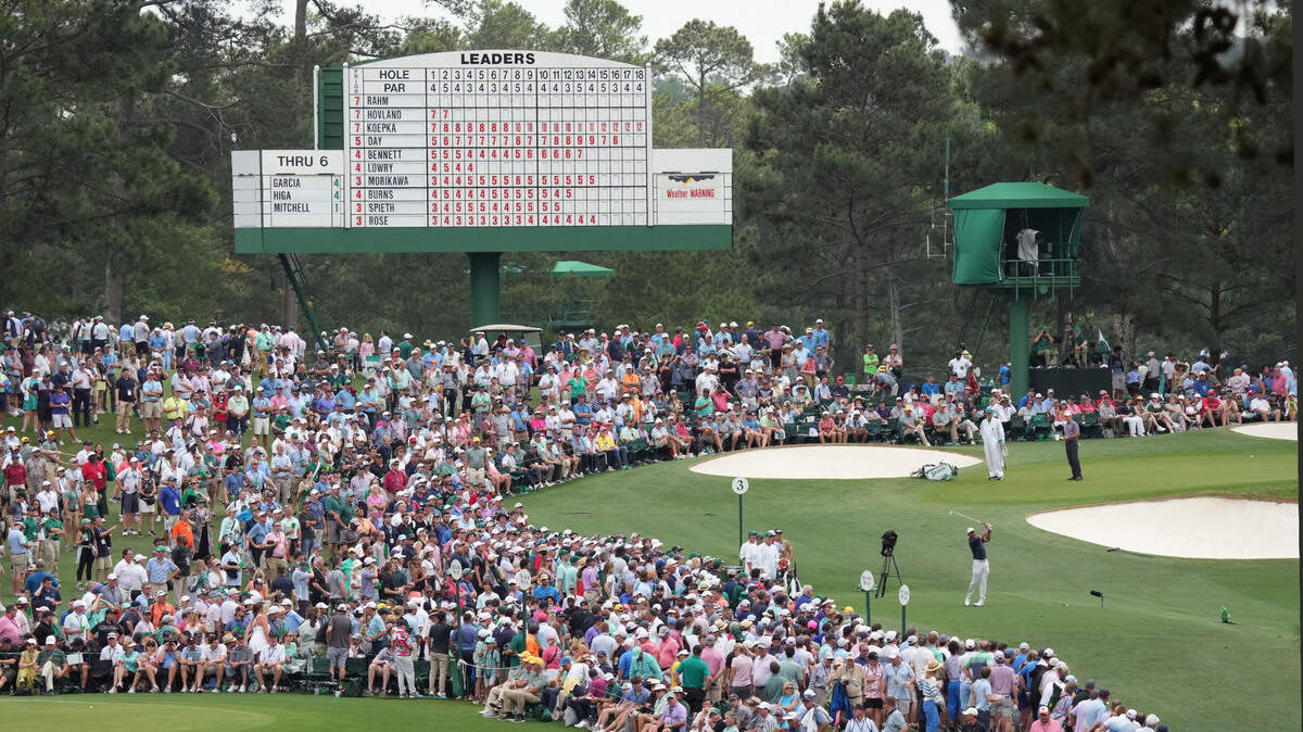 Tiger Woods plays his shot from the third tee Friday during the second round of The Masters golf tournament.
