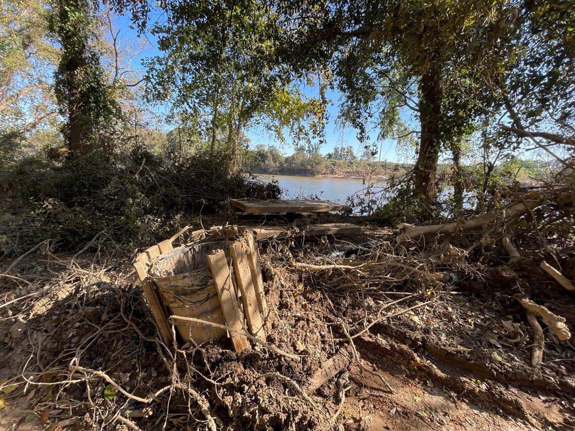 A layer of mud and debris, washed up from the Congaree River, covers the Cayce Riverwalk where the Congaree River over topped its banks. Heavy rains upstream from Hurricane Helene caused the river to crest at 30.58 feet.