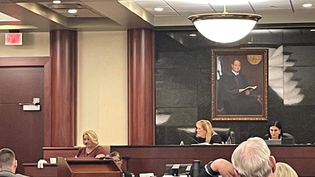 Tiffany Beitler, a friend of the wife of Adam Lazzarini, who is accused of killing a man, testifies at his trial.