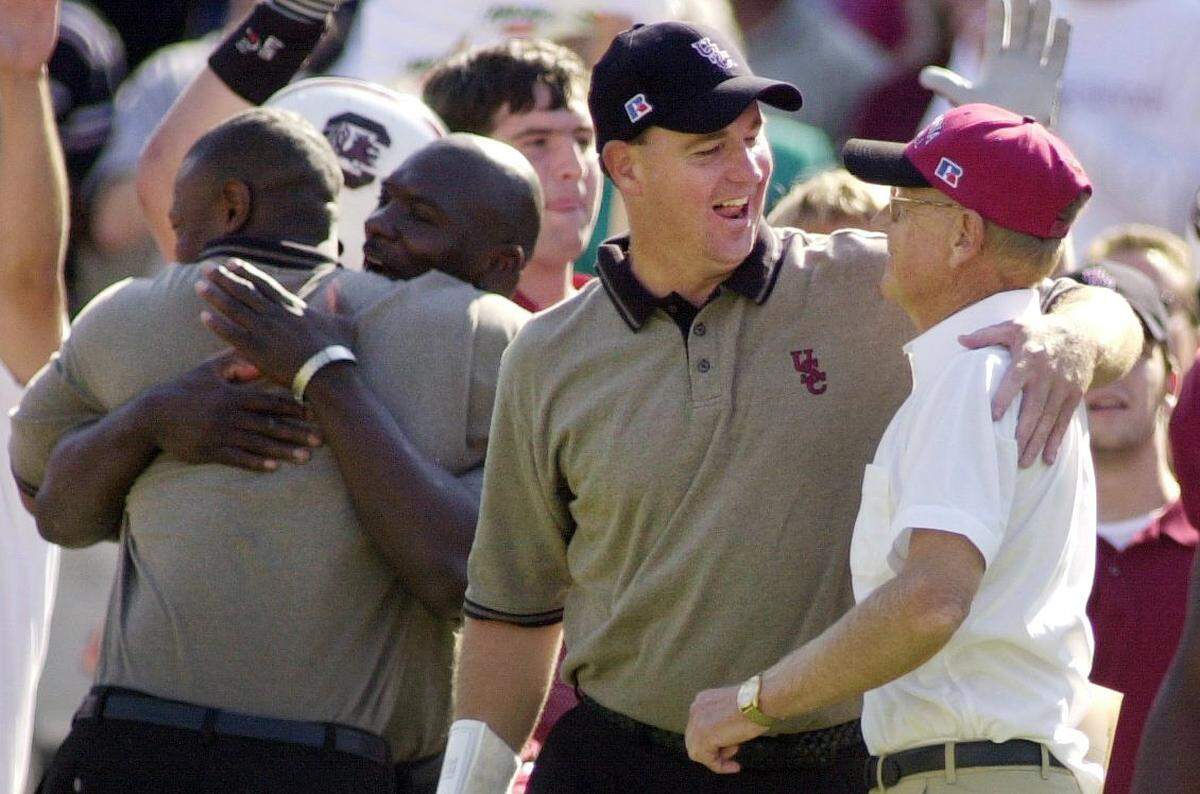 From Sept. 29, 2001: South Carolina coach Lou Holtz and assistant head coach Skip Holtz celebrate the Gamecocks’ win over Alabama.