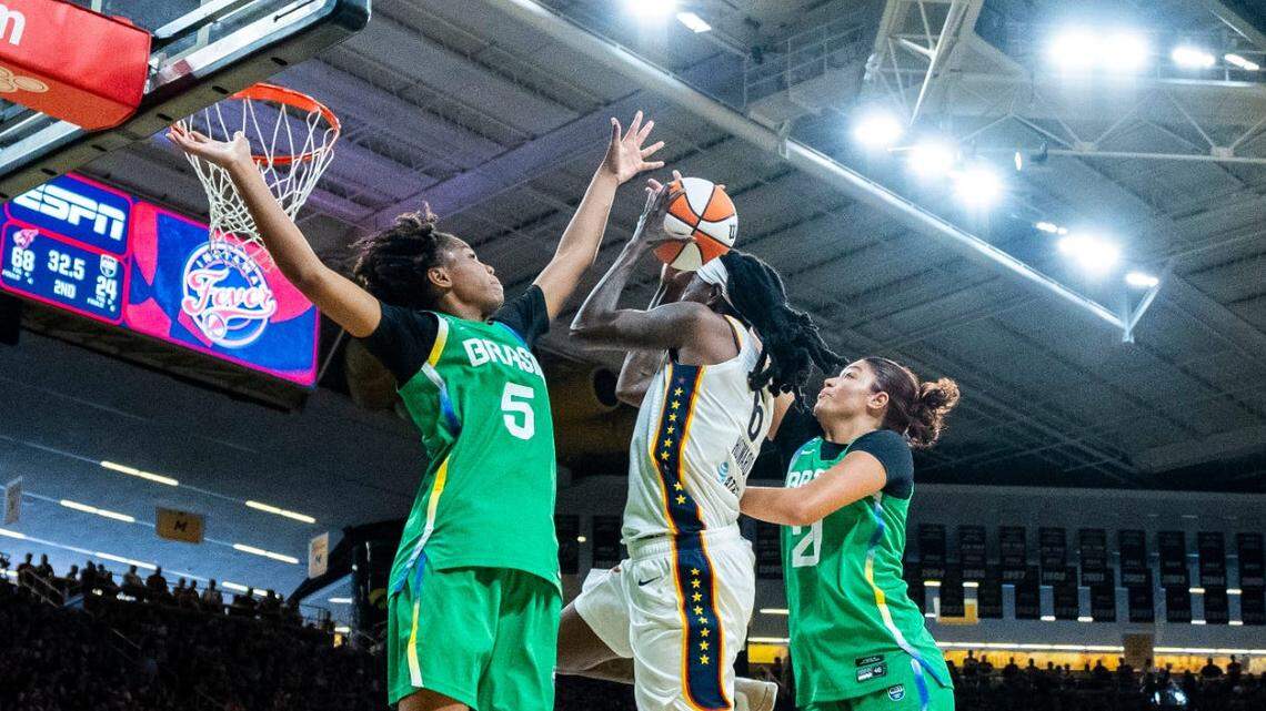 Indiana Fever forward Natasha Howard (6) goes up for a basket in the lane against Brazilian National Team forward Ayla McDowell (5) on Sunday, May 4, 2025, during a preseason game between the Indiana Fever and the Brazil national team at Carver-Hawkeye Arena in Iowa City.