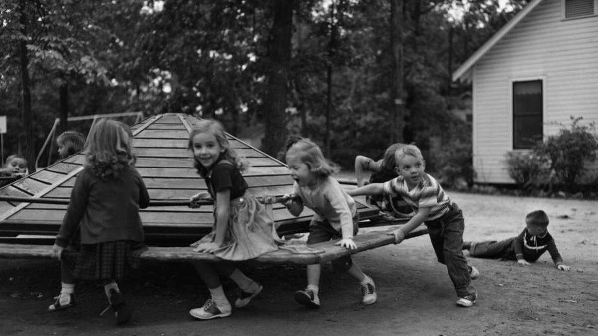 Preschoolers play at the Emily Douglas Park playground, Oct. 30, 1956. Photographed by Tom Nebbia. Courtesy of The State Newspaper photo archive.