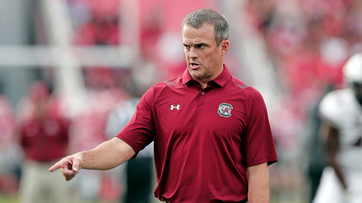 South Carolina Gamecocks head coach Shane Beamer directs warmups before his team plays Georgia at Sanford Stadium on Saturday, September 18, 2021.