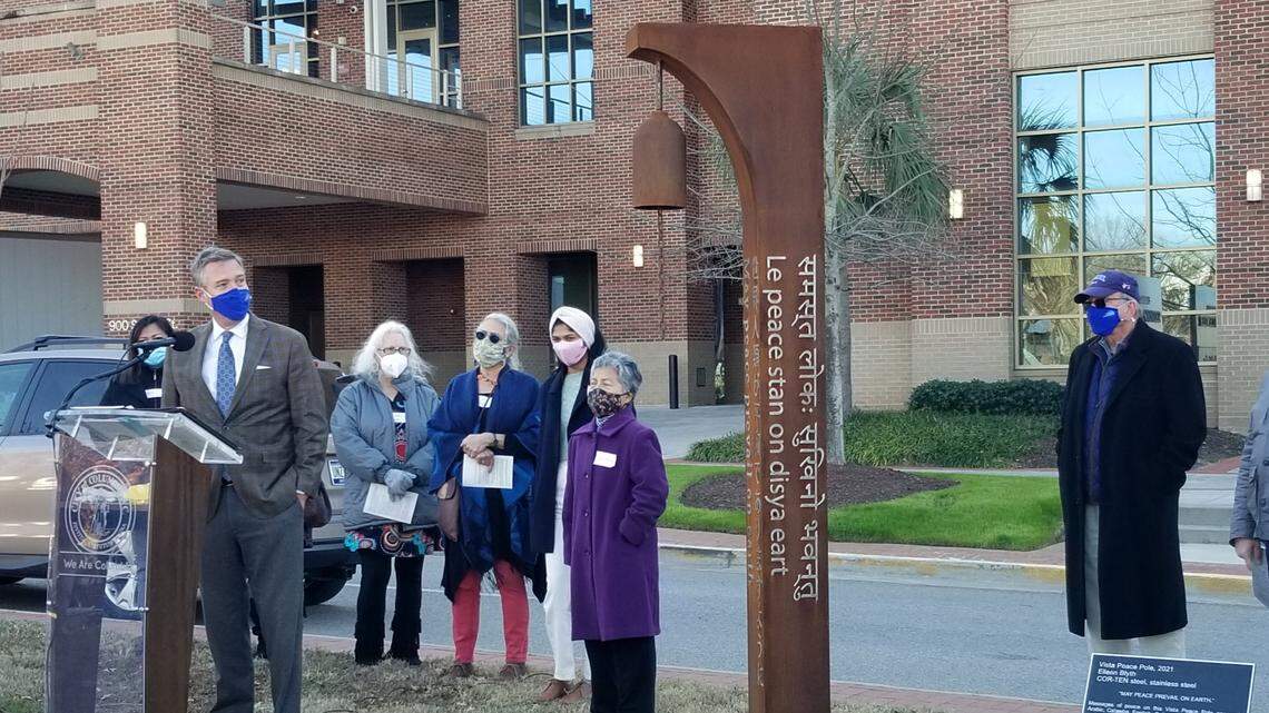 Columbia Mayor Daniel Rickenmann, left, was among those who dedicated the Vista Peace Pole in a ceremony on Tuesday, Jan. 11, 2022. The peace pole carries the message “May Peace Prevail on Earth” in eight different languages.