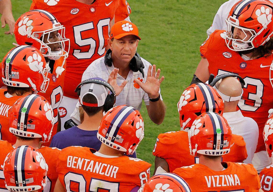 Clemson head coach Dabo Swinney talks with his team against Syracuse during second-half action in Clemson, S.C on Saturday, Sept. 20, 2025.