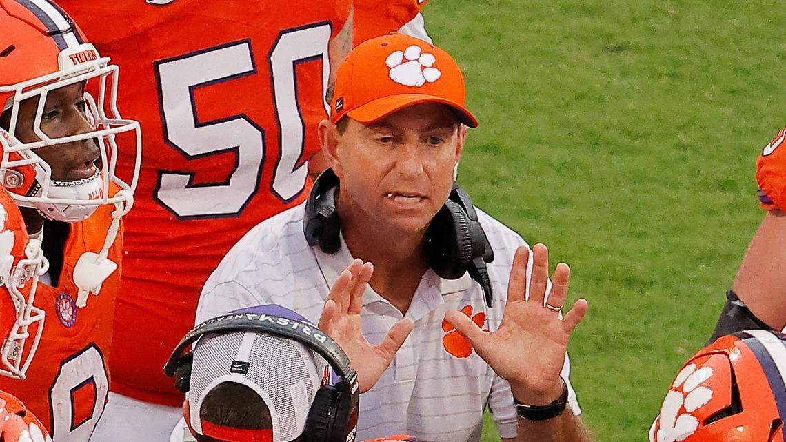 Clemson head coach Dabo Swinney talks with his team against Syracuse during second-half action in Clemson, S.C on Saturday, Sept. 20, 2025.