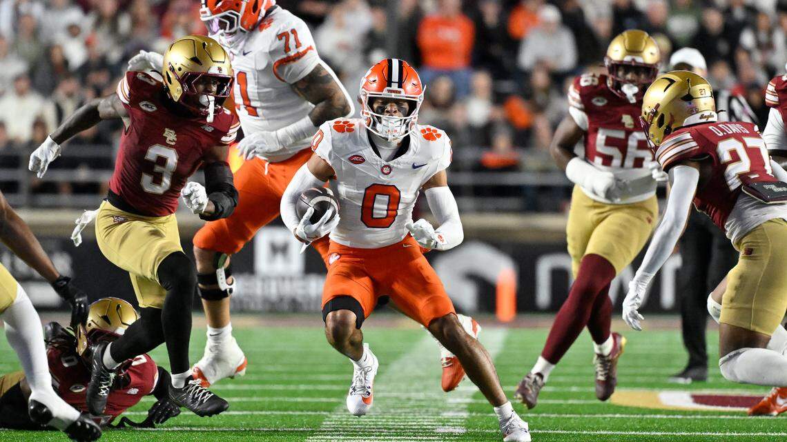 Oct 11, 2025; Chestnut Hill, Massachusetts, USA; Clemson Tigers wide receiver Antonio Williams (0) runs the ball with Boston College Eagles defensive back Max Tucker (3) giving chase during the first half at Alumni Stadium.