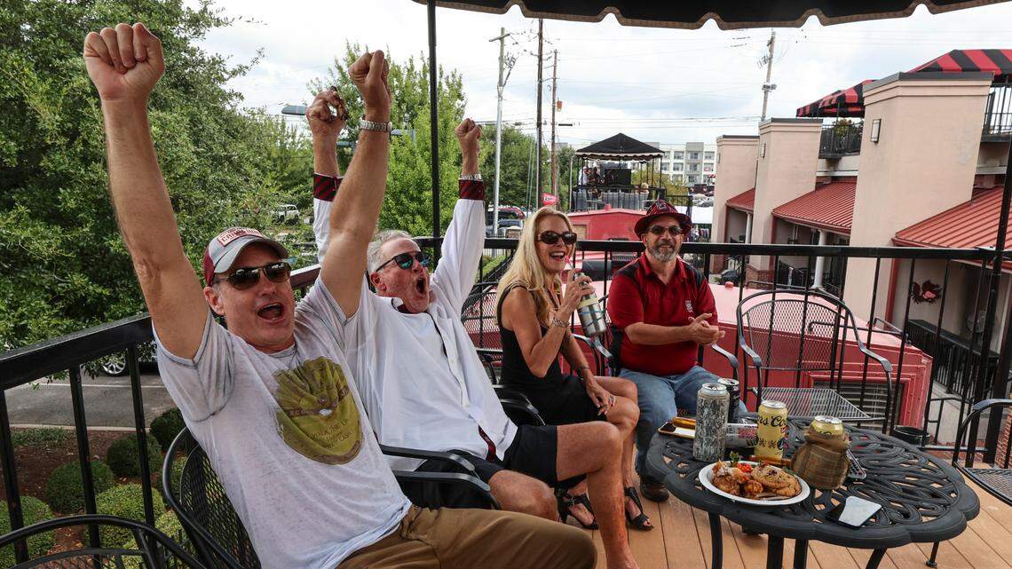 Steve Clary, from left, Tom Davant, Kim Devant and Paul Eskridge celebrate as USC scores a touch down against LSU on Saturday, Sept. 14, 2024. Tom Davant said he had not been inside the stadium to watch a game in six years.