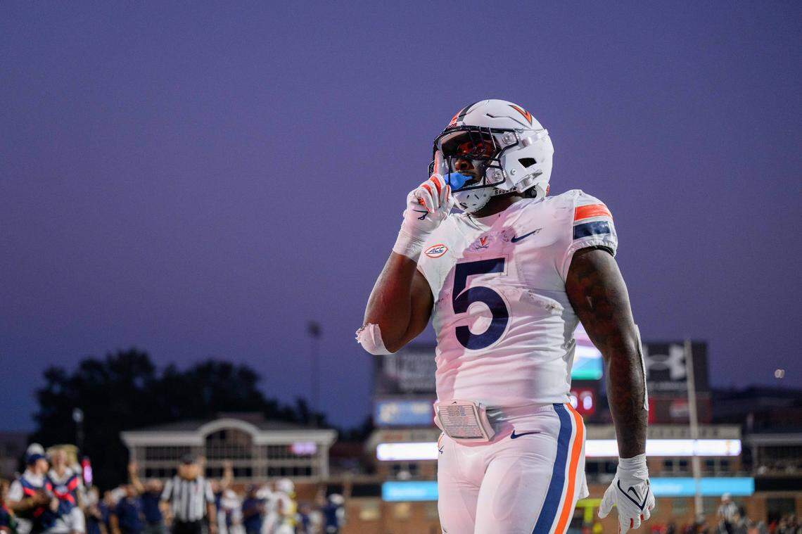 Sep 15, 2023; College Park, Maryland, USA; Virginia Cavaliers running back Kobe Pace (5) reacts after scoring a touchdown during the first quarter against the Maryland Terrapins at SECU Stadium. Mandatory Credit: Reggie Hildred-USA TODAY Sports