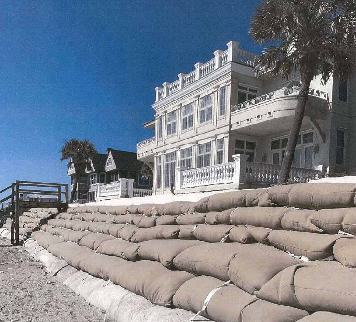 This home at Debordieu Beach, SC, has been protected by a wall of sand bags. Critics say that’s against state policy and bad for the beach. State environmental enforcement personnel have sought to have the sandbags removed because of their potential impact on the public beach.