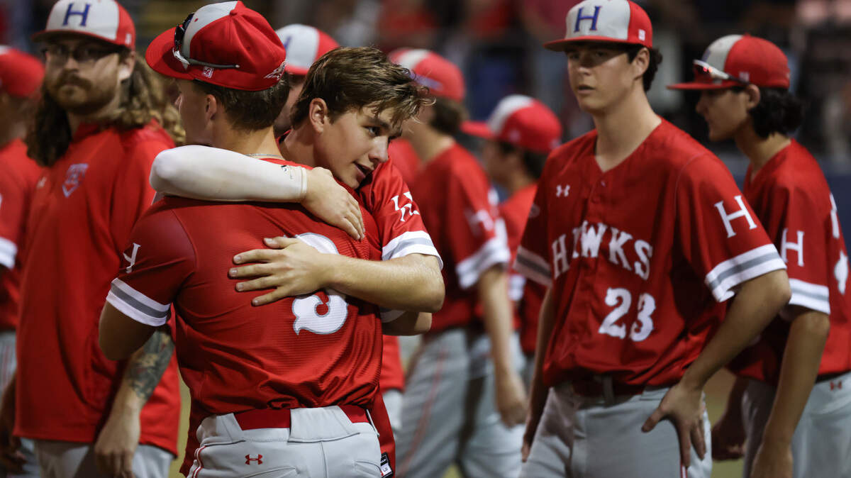 Michael Aitchison (3) hugs teammate Thomas Dennis (15) following Hammond’s loss to Augusta Christian in the SCISA Class 4A Baseball Championship at Lexington High School in Lexington on Monday, May 22, 2023.