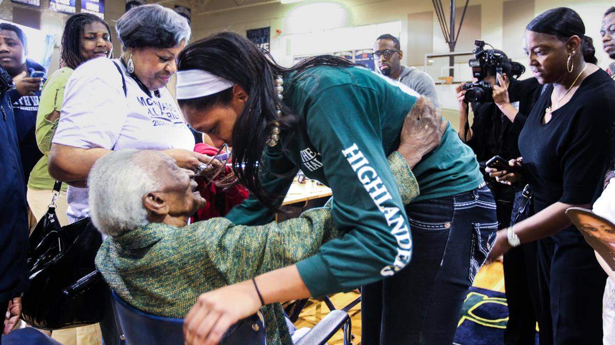 A'ja Wilson embraces her grandmother, Hattie Rakes,after celebrating her decision to attend USC and play basketball for The Gamecocks.