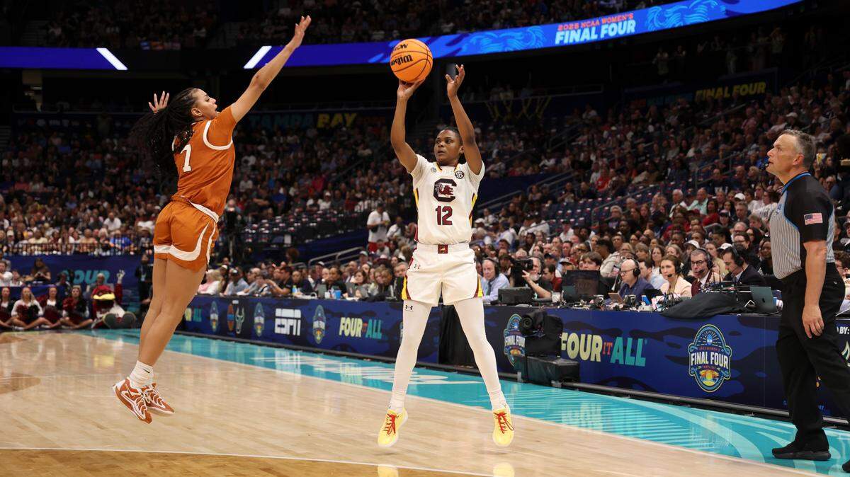 University of South Carolina’s MiLaysia Fulwiley (12) shoots as three-pointer during the first half of action as Texas’ Jordan Lee (7) defends at Amalie Arena in Tampa, Fla. on Friday, April 4, 2025.