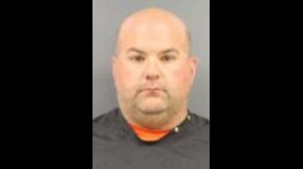 Derrick Greer was charged with assault and battery and fired by the Cherokee County Sheriff's Office.