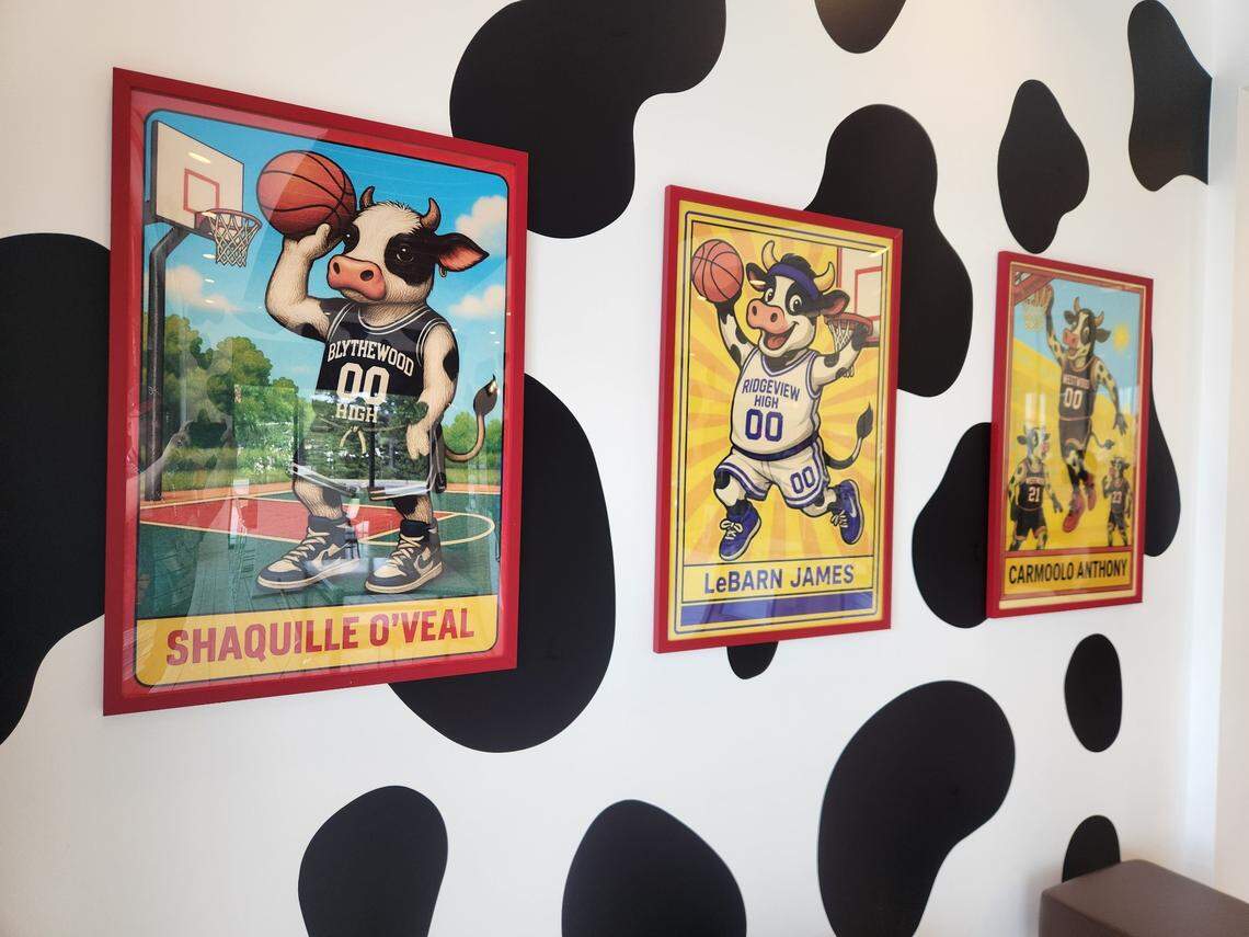 Cow posters, including one of “LeBarn James,” line the walls at Dulce Losa Ice Cream Factory in Columbia, SC.
