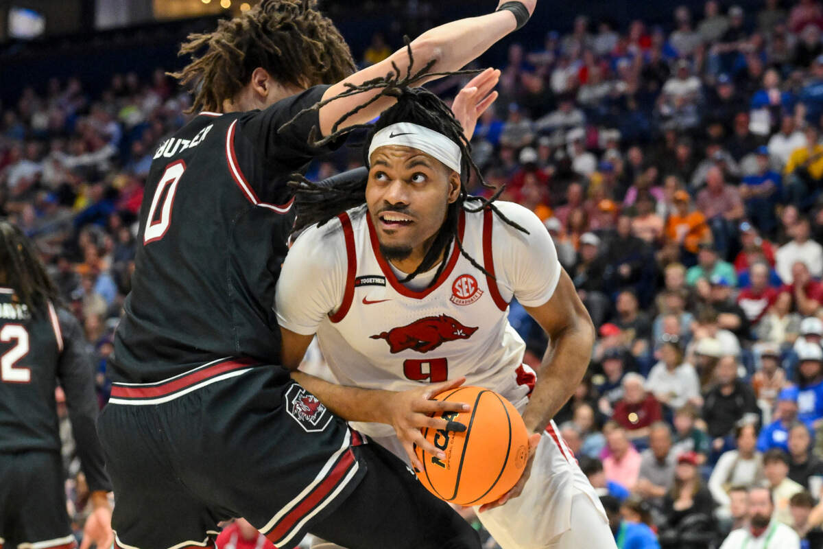 Arkansas Razorbacks forward Jonas Aidoo (9) goes up as South Carolina Gamecocks forward Jordan Butler (0) defends during the first half at Bridgestone Arena.