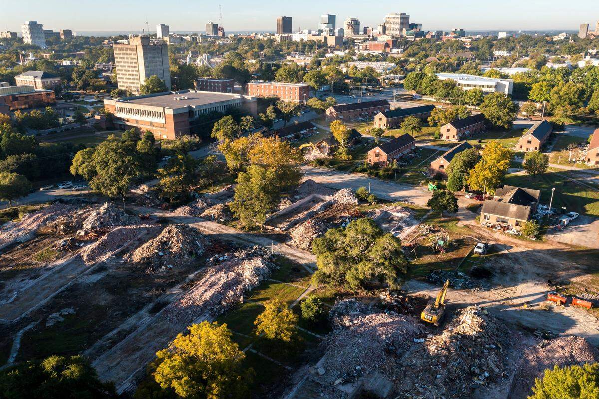 Crews demolish Allen Benedict Court Tuesday morning. The housing complex was built in 1940.