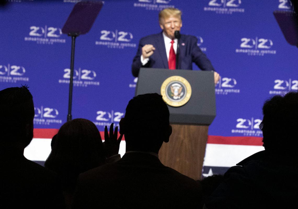 President Donald Trump speaks about criminal justice reform at the David Swinton Campus Center at Benedict College in Columbia, S.C. as supporters hold up the number four and chant ‘four more years’ (Tracy Glantz/The State Newspaper/ via AP, Pool) 10/25/19