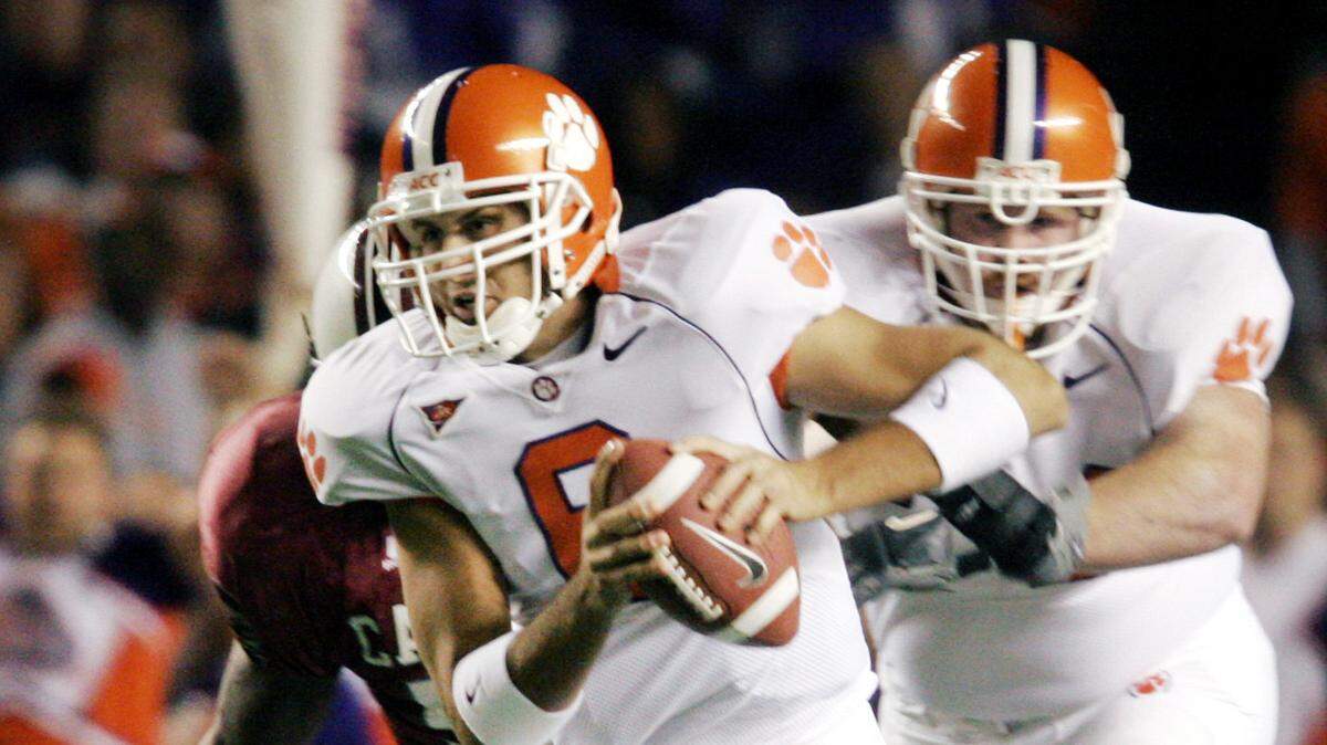 From Nov. 19, 2005, Clemson quarterback Charlie Whitehurst (6) runs with the ball as South Carolina’ s Orus Lambert tries to catch him at Williams Brice Stadium in Columbia. Whitehurst had 25 yards rushing and 172 yards passing as Clemson defeated South Carolina 13-9.