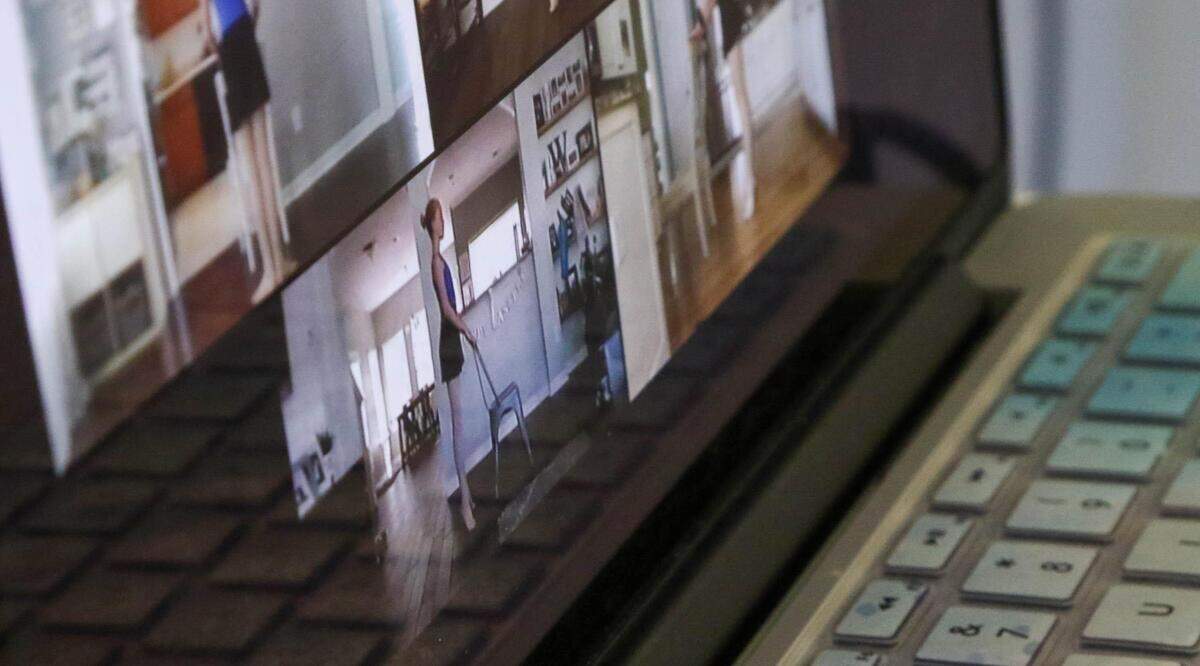 A computer monitor shows students practicing their dance routine from their homes on a computer. Due to the coronavirus, teachers at South Carolina Christian Dance Theater in Irmo are connecting with their students through video, via the internet.