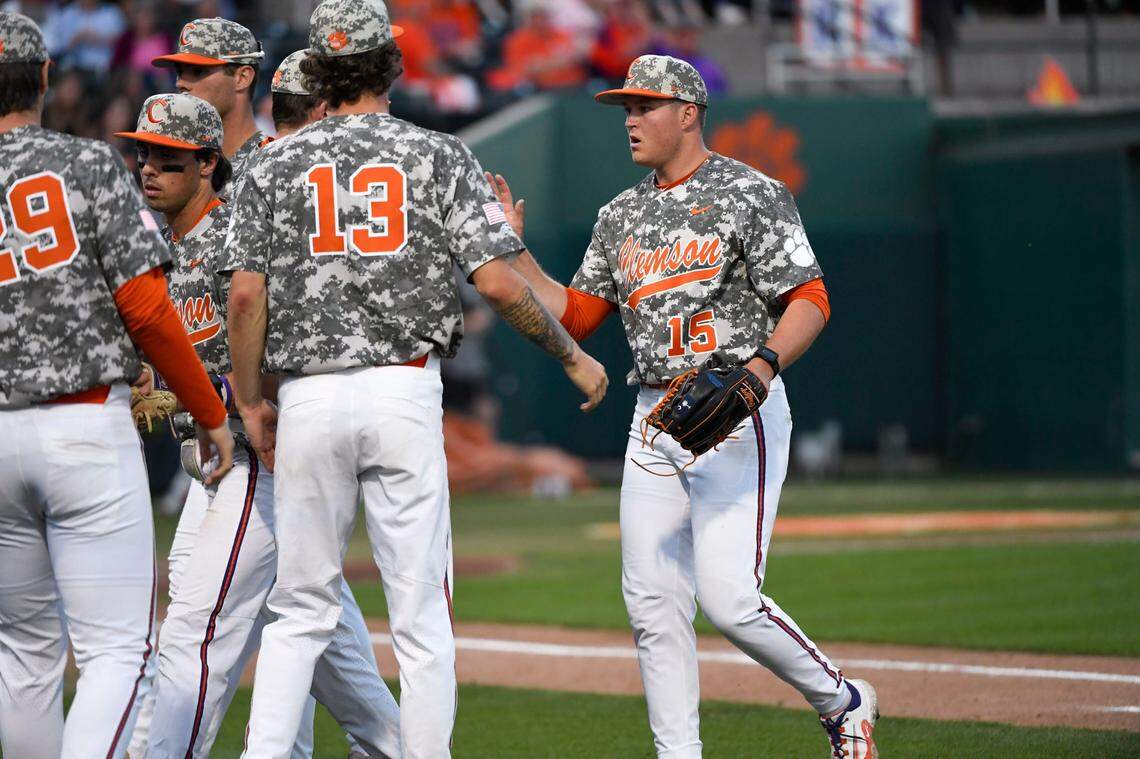 Clemson sophomore Reed Garris (15) high-fives his teammates after pitching during a game against Georgia at Doug Kingsmore Stadium in Clemson Tuesday, April 18, 2023. Gre Ml Clemsonvgeorgiabaseball 04182023 023