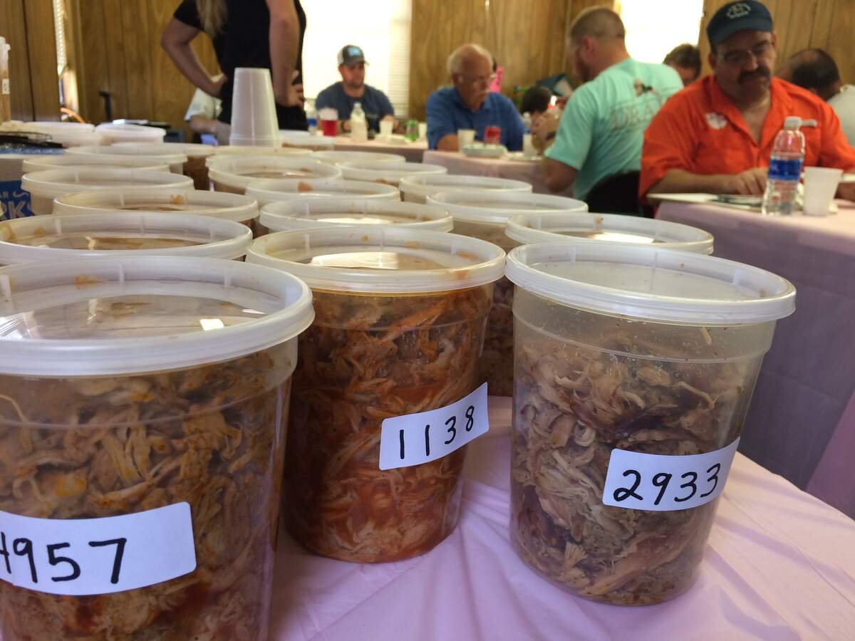 Containers of pulled pork barbecue are arranged on a table for judges to sample during the 30th Annual South Carolina BBQ Shag Festival in Hemingway, SC, April 14, 2018.