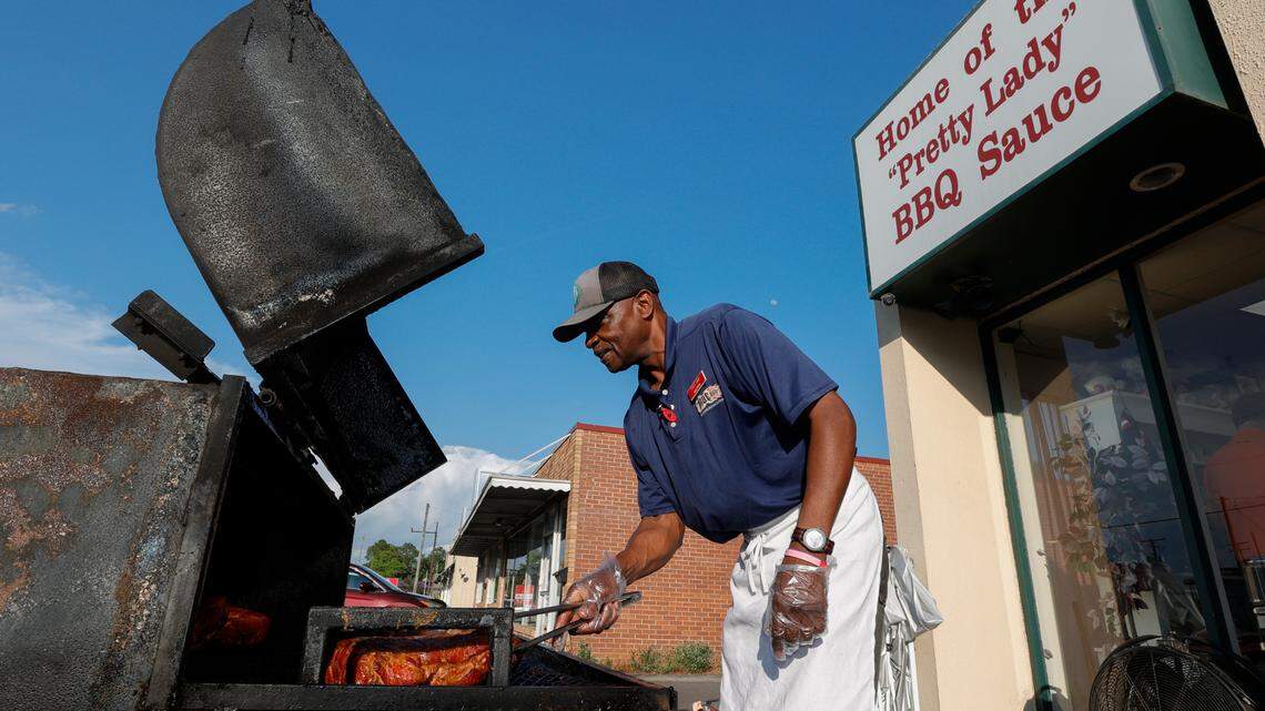 Milton Zanders tends to smoked pork on his grill outside True BBQ on Friday April 19, 2024. The restaurant is in the Triangle City area of West Columbia.