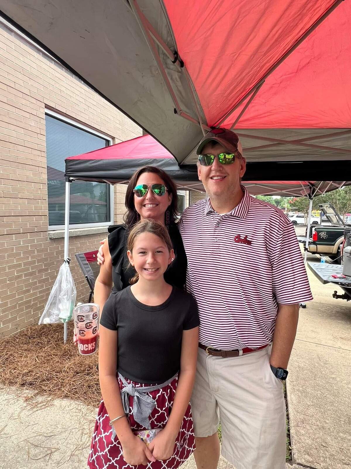 Reed Dyches, right, with his wife, Tonya, and daughter, Elise. Reed was a huge South Carolina Gamecocks football fan.