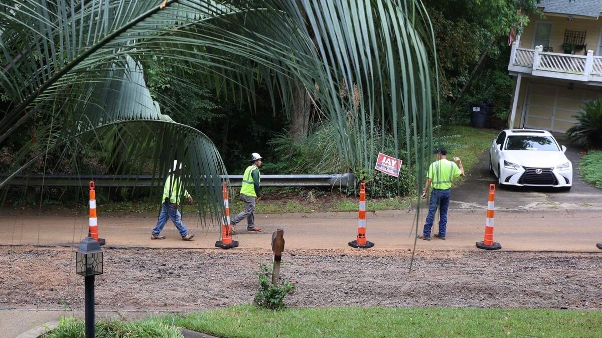 Crews work to repair the road on Willow Bend Court in Irmo where a water line was broken in September 2024 as subcontractors for Lumos Fiber were installing cable for fiber optic cable. The broken line created a sinkhole, making the road impassable.