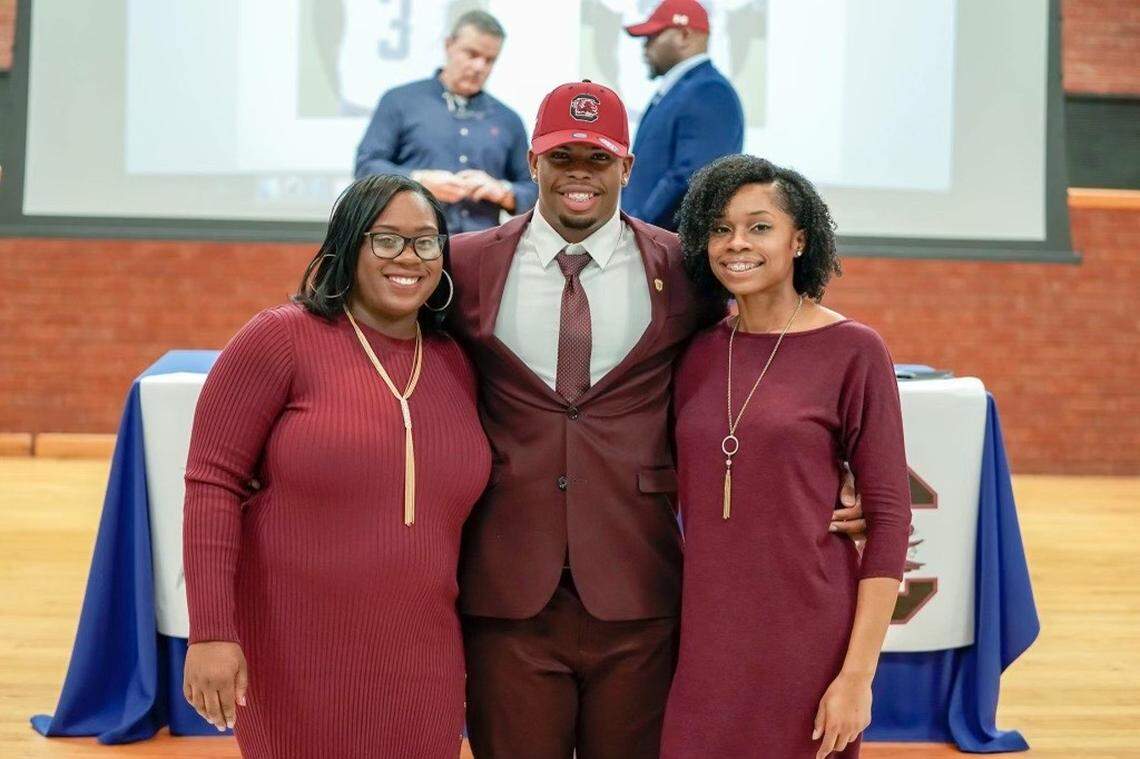 Kevin Harris signed with the Gamecocks in the 2019 recruiting class. He’s pictured here on signing day with sisters Makalah, left, and Candace.