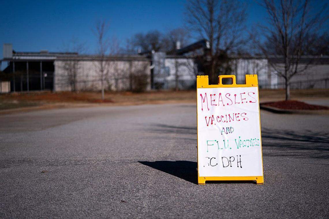 The South Carolina Department of Health reported 950 cases of measles Friday, with the outbreak centered in Spartanburg County. A sign outside a mobile clinic offering measles and flu vaccinations on February 6, 2026, in Spartanburg, S.C. The clinic offered free MMR vaccinations and will be back in Spartanburg on Tuesday, March 3.