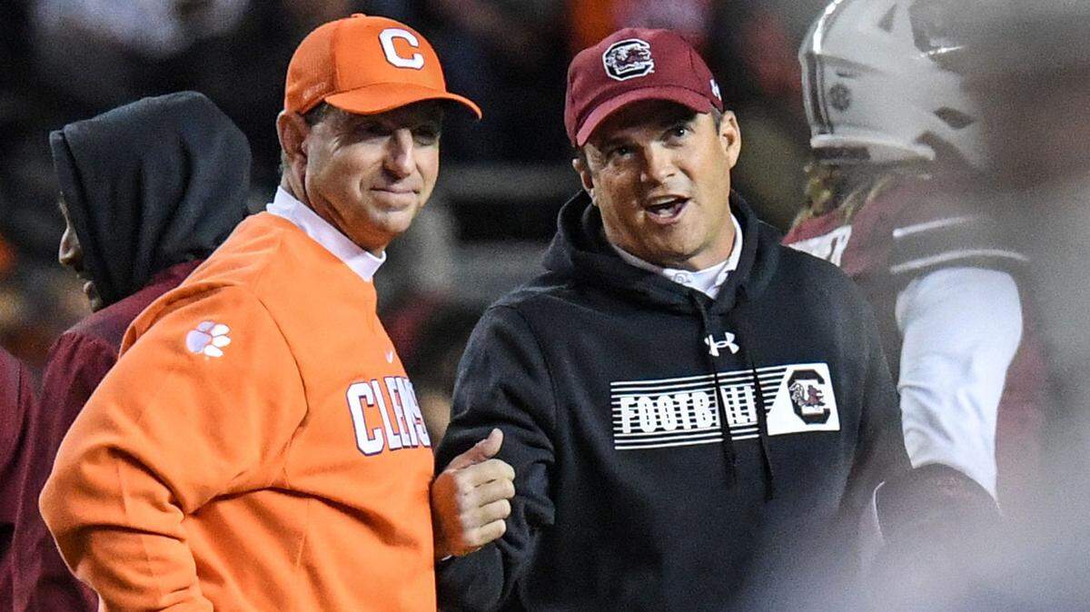 Clemson head coach Dabo Swinney and South Carolina Head Coach Shane Beamer talk before the game at Williams Brice Stadium in Columbia, South Carolina Saturday, November 27, 2021.