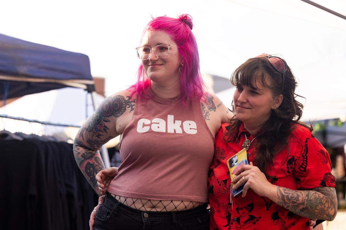 Friends of Christine Fowler and Sharon Thrailkill watch their wedding at Y’all-Mart, a quarterly art fair series, at Art Bar in Columbia, South Carolina on Sunday, February 9, 2025.