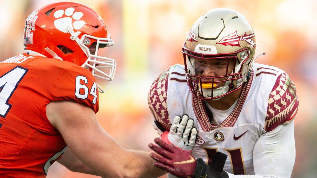 Clemson offensive lineman Walker Parks (64) blocks Florida State defensive end Jermaine Johnson II (11) during the second half of an NCAA college football game, Saturday, Oct. 30, 2021, in Clemson, S.C. (AP Photo/Hakim Wright Sr.)
