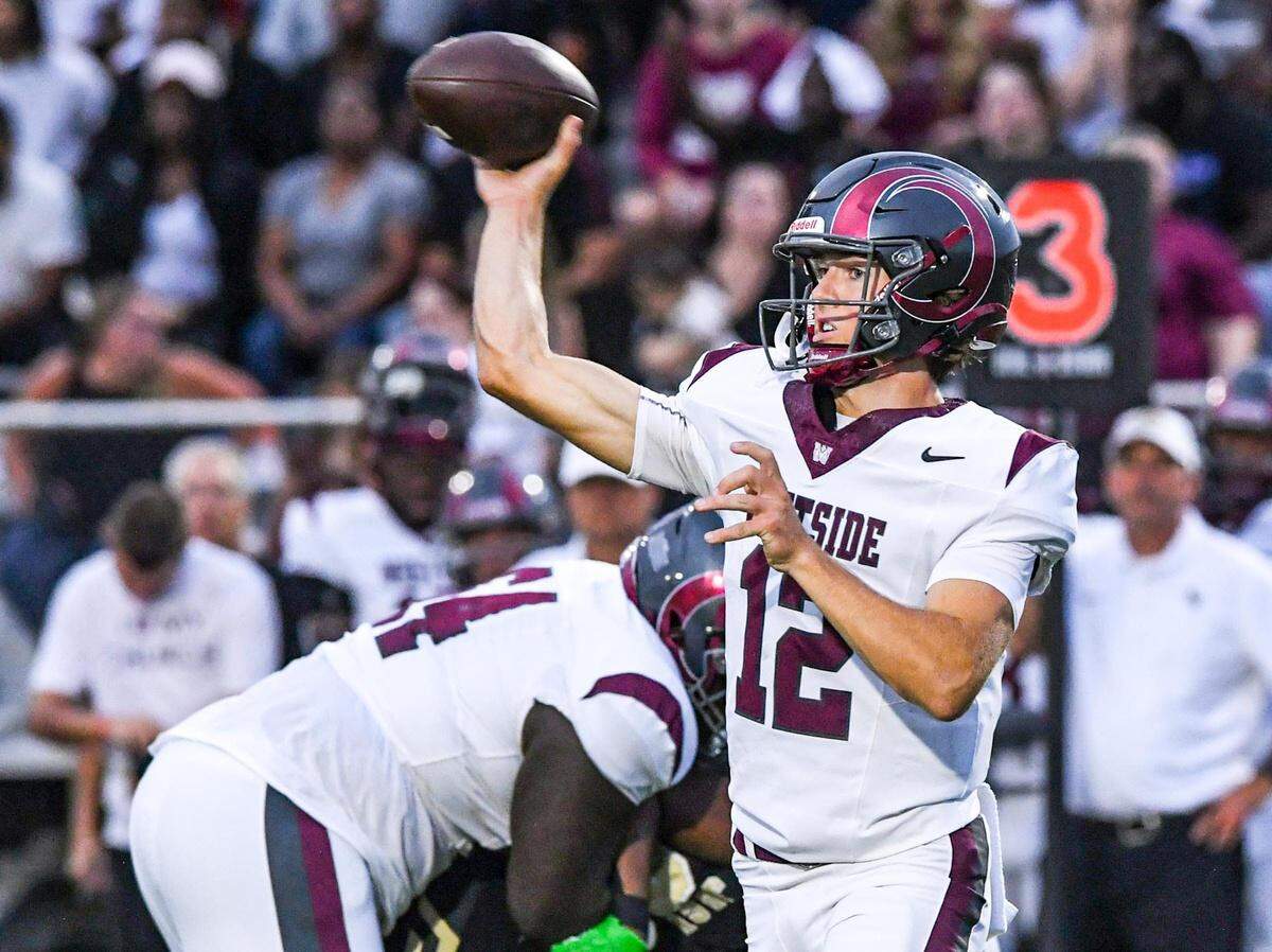Westside High senior quarterback Cutter Woods (12) throws during the first quarter at T.L. Hanna High in Anderson, S.C. Friday, September 6, 2024.