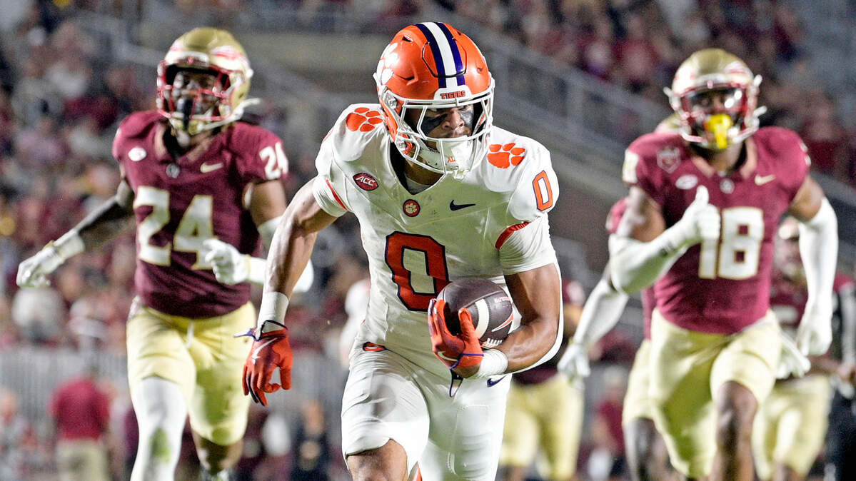 Oct 5, 2024; Tallahassee, Florida, USA; Clemson Tigers wide receiver Antonio Williams (0) scores a touchdown against the Florida State Seminoles during the first half at Doak S. Campbell Stadium. Mandatory Credit: Melina Myers-Imagn Images