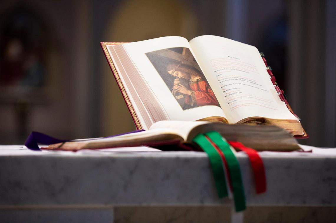 A bible open to the opening of a Latin mass at St. Peter’s Basilica in downtown Columbia, South Carolina on Thursday, April 2, 2020. On Thursdays St. Peter’s has modified Latin mass, with some parts in English.